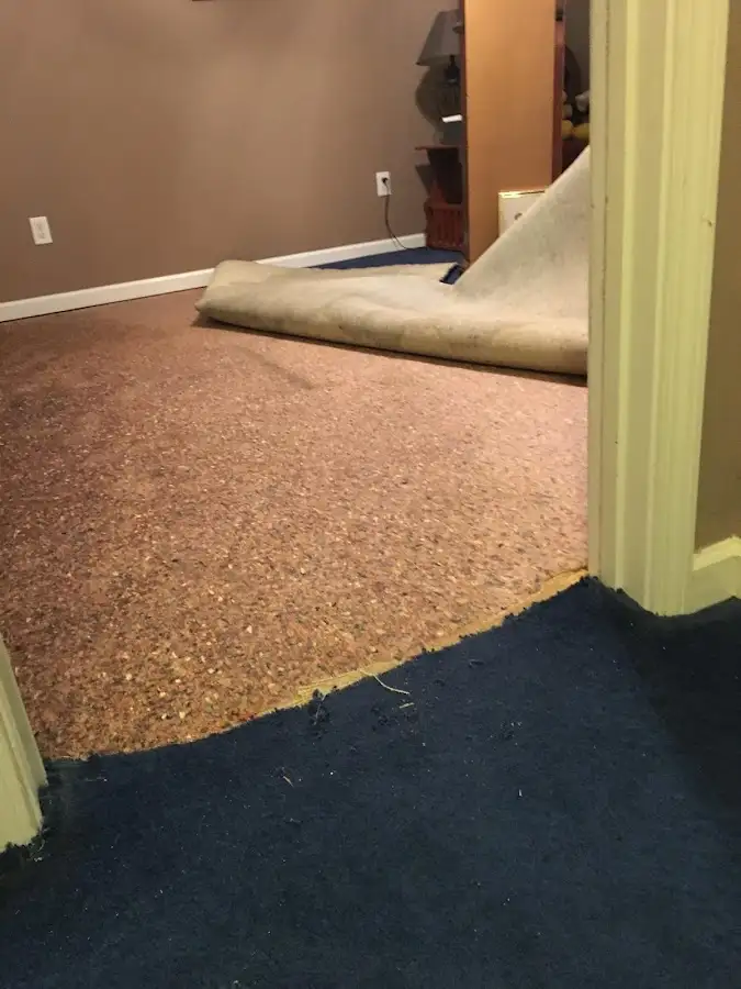 Carpet pad removal revealing water damage during Drying & Dehumidification in Lindon