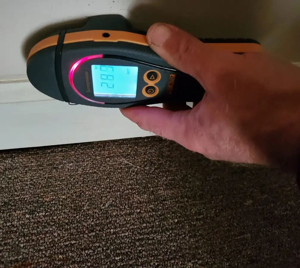Moisture detection at baseboard during Storm Damage Restoration in Lindon